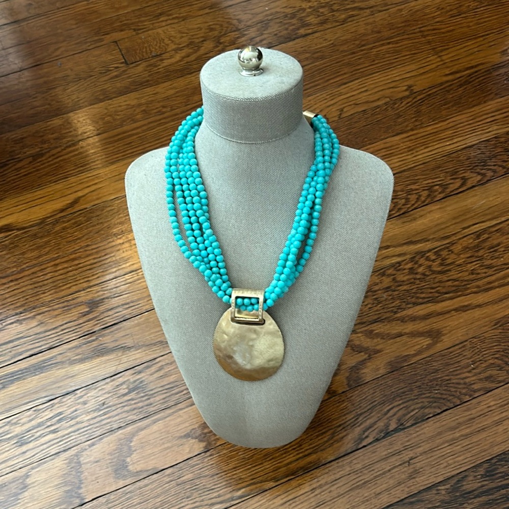 Turquoise and brass statement necklace.